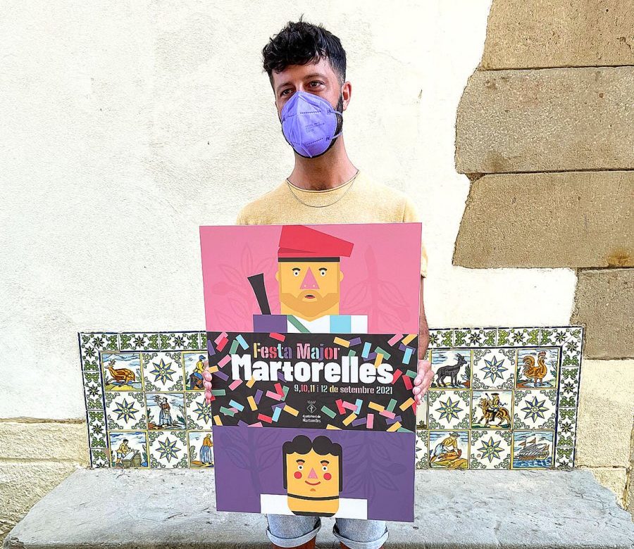 David Gutiérrez amb el cartell que ha dissenyat